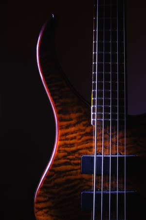 Details of modern but dusty five strings bass guitar, body and neck.の写真素材