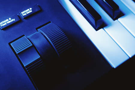 Closeup view of pitch and modulation wheels of a modern synthesizer.の写真素材