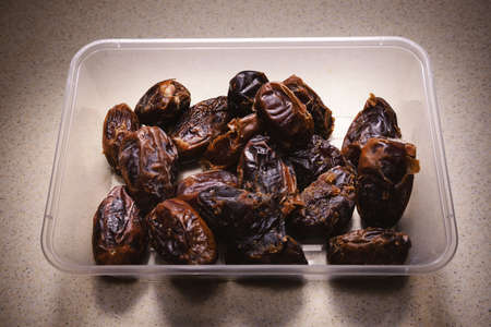 Tasty date palms from Iran in plastic container.の写真素材