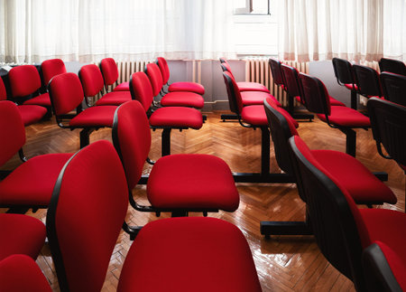 Interior of a classroom with red chairs.の写真素材