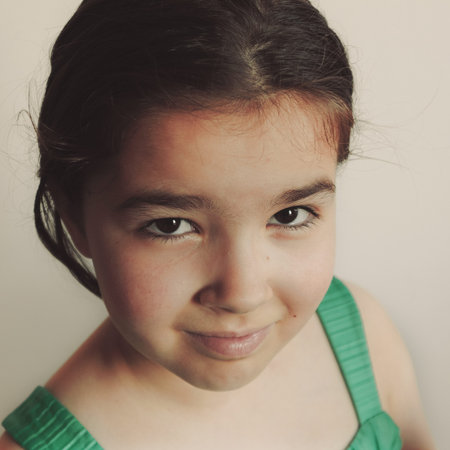 Small girl posing, facial expression.