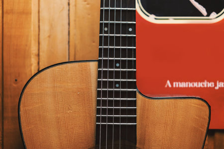 A view of one part of the body of an old acoustic gypsy guitar, in the style of Django Reinhardt....