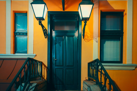 Cheerful colors of one entrance to the house, everything is new, orange walls and decorative lanterns.の写真素材