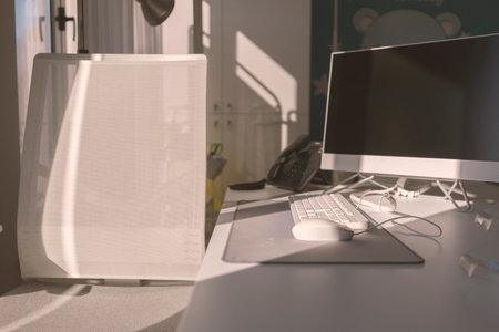View of modern office furniture, chair, desk and computer.