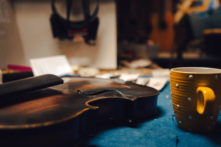 Repair and restoration of an old violin, on the table, detail of the workshop.の写真素材