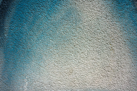 Texture of a wall painted in a strong color, details of materials and colors.