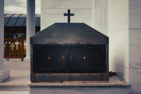 Detail from the Orthodox church, a memorial metal box for lighting candles for the dead, as a...