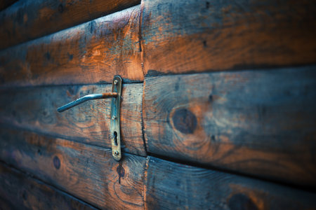 Texture of wooden door with handle and lock, close up view.の写真素材