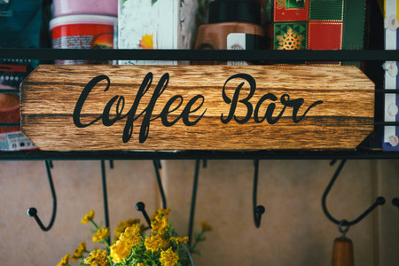 Details of a modern decorative coffee and tea shelf with Coffee Bar written on it.の写真素材