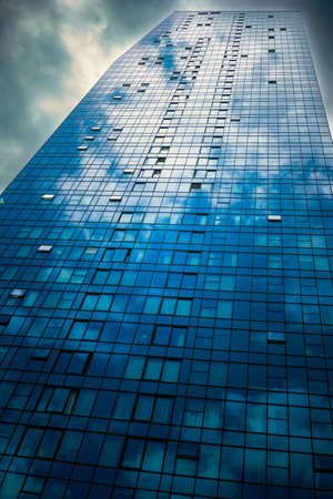 Big blue glass skyscraper in New Belgrade, Serbia, abstract composition.の写真素材