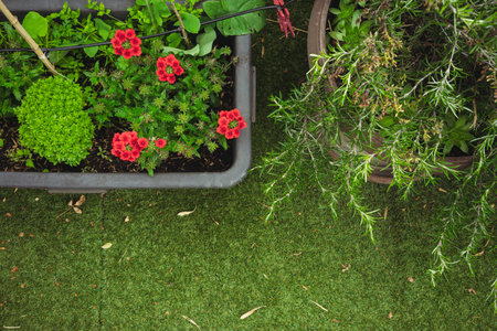 Decorating the terrace with artificial grass and flowers.の写真素材