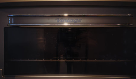 Vintage inscription on the handle of an old oven.