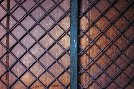 Metal wooden bars on a wooden wall, abstract composition.