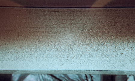 Pages of a large book, macro view with focus on the paper between the covers.