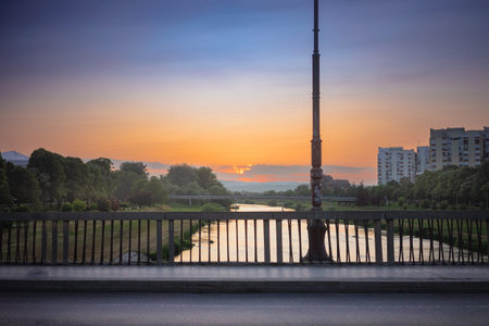 View of the river from the bridge in the evening in the Balkan town, Cacak town and the West Morava river in Serbia.の写真素材