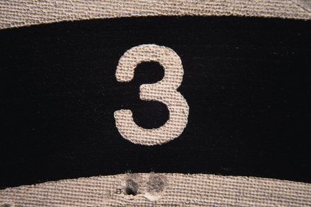 Number 3 on a used dartboard, close up view.の写真素材