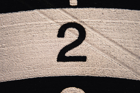 Number 2 on a used dartboard, close up view.の写真素材