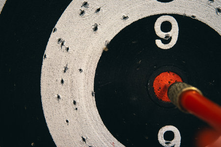 Red dart arrow right in the center, close up view.の写真素材