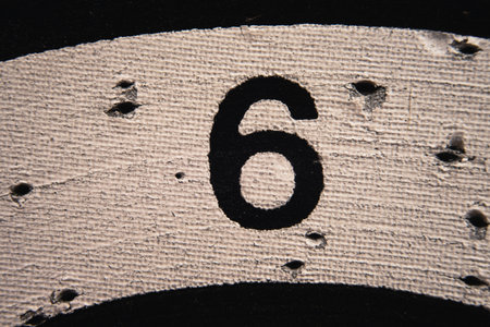 Number 6 on a used dartboard, close up view.の写真素材