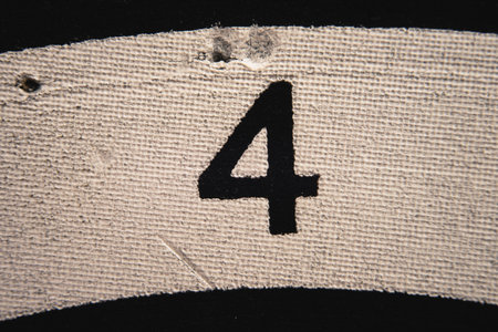 Number 4 on a used dartboard, close up view.の写真素材