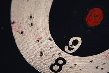Numbers 8, 9 and center on a used dartboard, close up view.の写真素材
