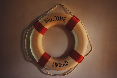 A lifebuoy as a decoration on the wall with the inscription Welcome Aboard.の写真素材