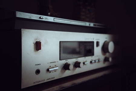 Old home hi-fi amplifier and receiver with cd player on top.の写真素材