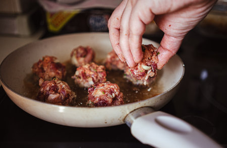 Homemade minced meat steaks, details of the kitchen counter while the food is being prepared.の写真素材