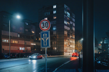 Evening street scene in a Balkan town during November, rainy and cold weather.の写真素材