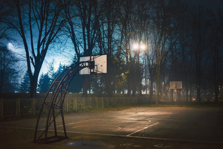 School basketball court at night in autumn, town of Cacak in Serbia.