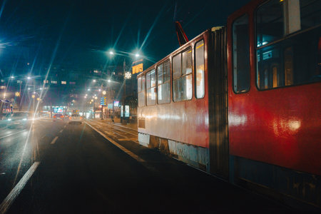 Belgrade, Serbia - January 22, 2026: Belgrade tram on the streets of the city center, at night.のeditorial素材