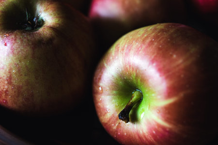 Macro composition of washed red green apples.