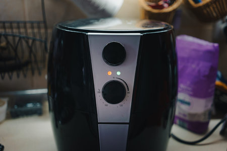 Details of a small electric oven up to 200 degrees Celsius.の写真素材