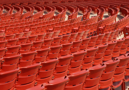 Red Stadium Seats in a Semicircle Pattern