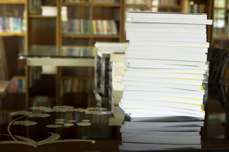 Books stack in library.の写真素材