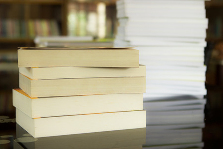 Books stack in library.の写真素材