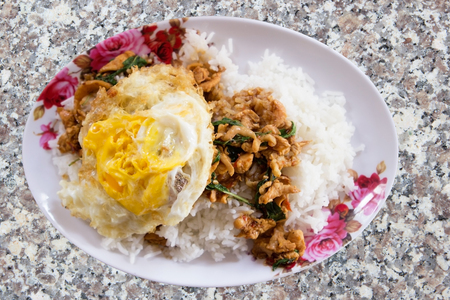Stir-fried minced pork with holy basil and steamed rice Thai food.の写真素材