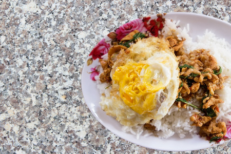 Stir-fried minced pork with holy basil and steamed rice Thai food.の写真素材