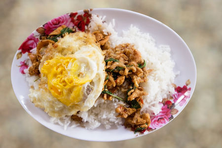Stir-fried minced pork with holy basil and steamed rice Thai food.の写真素材