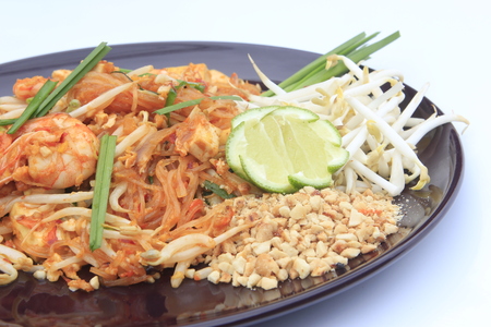 Thai food Pad thai , Stir fry noodles with shrimp in padthai style isolate white background.の写真素材