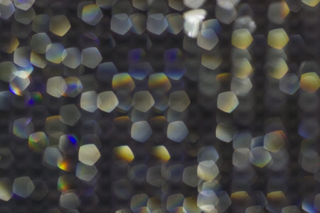 Abstract dark glitter lights blur texture or background.