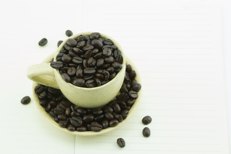 Cup of coffee beans isolate on white background.の写真素材