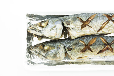 Fried Saba on foil wrapped.の写真素材