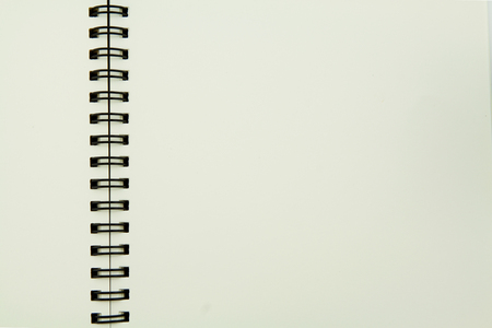 Open notebook with space on white background.の写真素材