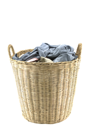 Clothes in a laundry wooden basket isolated on white background.の写真素材