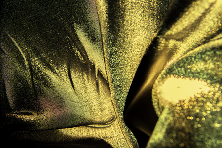 Gold wavy. Luxury cloth or liquid wave or wavy folds of grunge silk texture . Abstract concept.の写真素材