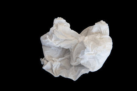 Used screwed paper tissue on dark background. Valueless.の写真素材