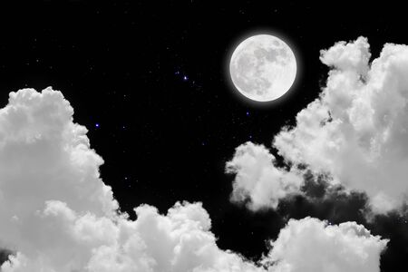 Full moon with starry and clouds background. Dark night.の写真素材