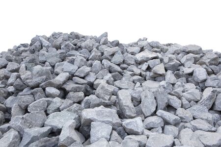 Piles of crushed stone isolate on white.の写真素材