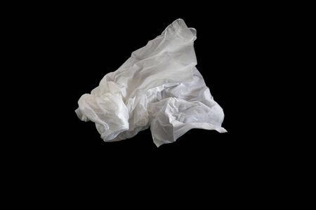Used screwed paper tissue on dark background. Valueless concept.の写真素材